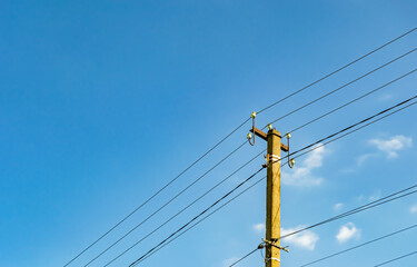 Power electric pole with line wire on colored background close up