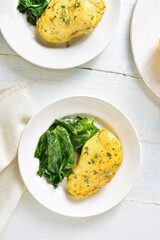 Baked turmeric chicken breast and sauteed spinach