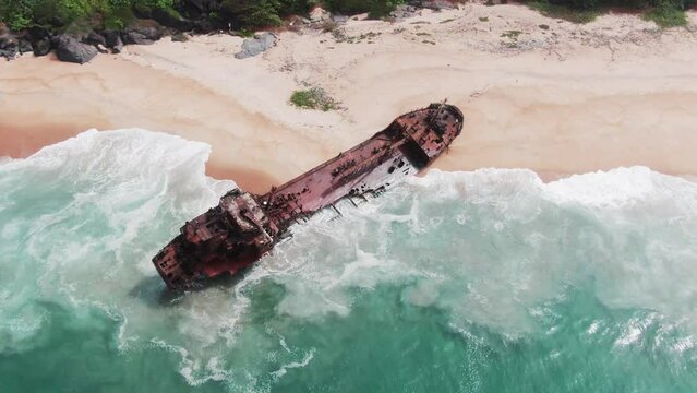 rusty shipwreck of an oil tanker stranded on west african coast in Robertsport, Liberia