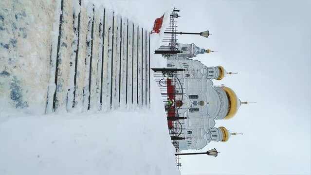 Belogorsky St. Nicholas Orthodox Missionary Monastery. Russia, Perm Krai, Belaya Gora. The temple on the hill in winter. Monastery on the background of snow. 4K