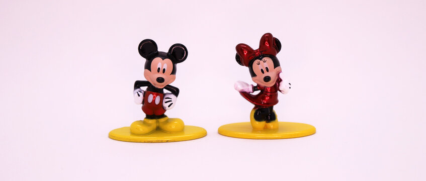 Mickey Mouse and Minnie Mouse. Cartoon characters from Walt Disney Pictures Studios. Mickey is Minnie Mouse's boyfriend. Mickey Mouse's house. Classic Mickey. Banner. Car. Metal dolls. Isolated white