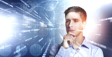 Young analyst focused on stream of binary code and big data statistics flowing in a virtual screen.
