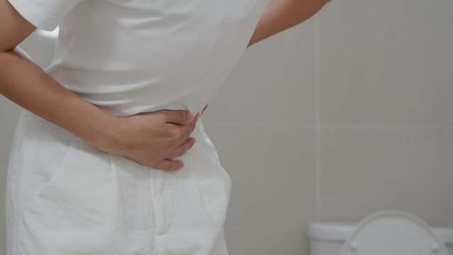 Constipation and diarrhea in bathroom. Hurt woman touch belly  stomach ache painful. colon inflammation problem, toxic food, abdominal pain, abdomen, constipated in toilet, stomachache, Hygiene