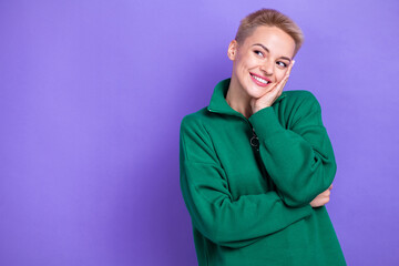 Photo of charming satisfied lovely lady touch cheeks short blonde hair looking toothy beaming smile empty space isolated on purple color background