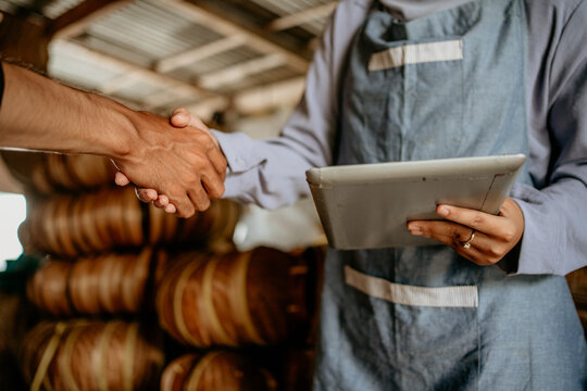 Close Up Of A Hand Shake Between Seller And Customer In Handicraft Workshop