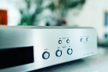 Obraz premium Details of vintage Hi-Fi radio tuner band preset arrow selection buttons on the aluminum front panel