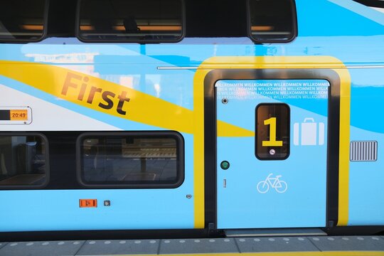 SALZBURG, AUSTRIA - AUGUST 4, 2022: First class section entrance Stadler Kiss passenger train of Westbahn railways at Salzburg railway station in Austria.