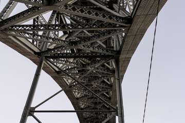 View from below of the Luis I Bridge in Porto, Portugal, over the Douro River