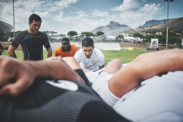 Ready to engage. two young rugby teams competing in a scrum during a rugby match on a field.