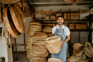 portrait of male handicraft artist working at his shop