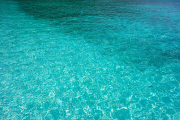 Transparent clear water. Surface of a sea turquoise color.
