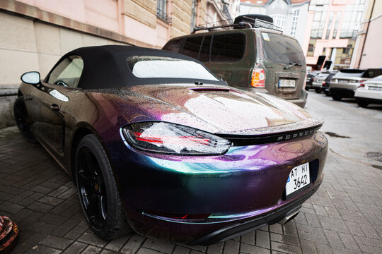 Ivano-Frankivsk, Ukraine - March, 2023: Chameleon holographic colour Porsche Boxter car.