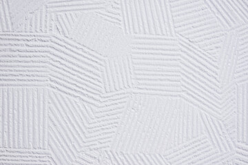 white plaster wall background with abstract decorative pattern