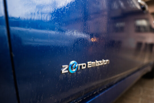 Ivano-Frankivsk, Ukraine - March, 2023: Zero emission logo on a Nissan Leaf electric car.