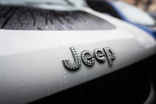 Ivano-Frankivsk, Ukraine - March, 2023: Swarovski crystals on Jeep logo at car.