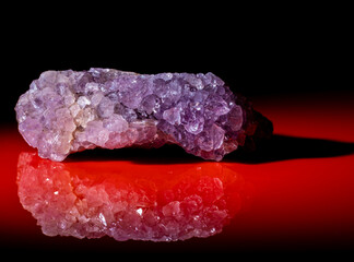 Mineral Amethyst with colored crystals close-up.