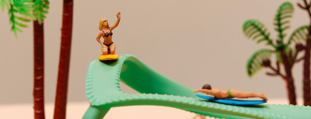 miniature surfers on a green flip-flop, banner