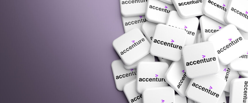 Logos of the professional services company Accenture (information technology services and consulting) on a heap on a table. Copy space. Web banner format.