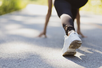 Athlete runner running woman on street in public park.