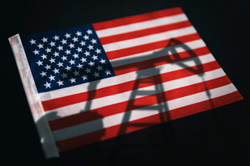 oil industry of USA . Oil rigs on the background of the United States of America flag. Mining and...