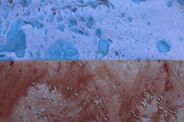 Close up original beautiful unique marble pattern papers interior of book cover, fabric abstract design red blue colour tones created ancient texture oil paint turps technique of  mix swirl on water