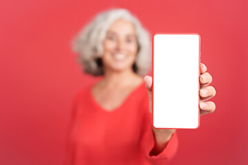 Blank screen of the mobile held by a woman