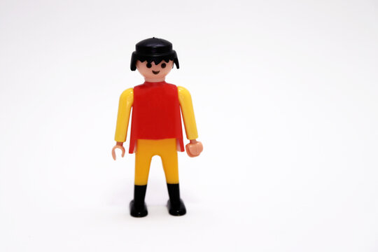 Playmobil figure. Collectible doll. Toy man in work suit. Person. Employee. Isolated white. Happy person. People.