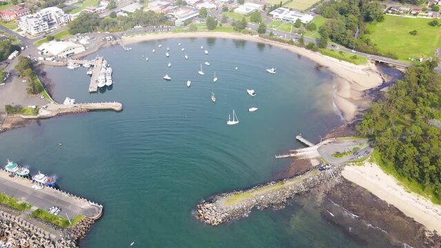 Aerial drone view of Ulladulla in the City of Shoalhaven, NSW, Australia, moving over Ulladulla Harbour 