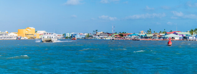 A view approaching the port of Belize City, Belize from the sea on a sunny day