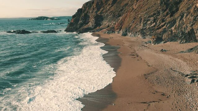 Ocean waves crashing on wild coastline in South Devon, England