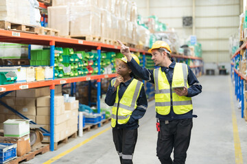 Warehouse workers and managers check stock.