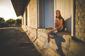 Fototapeta na wymiar Young Woman Skateboarding in an Urban Environment