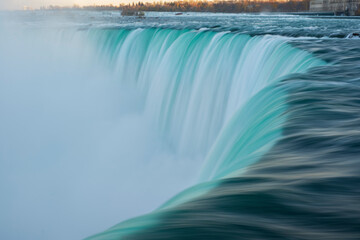 Close view of Horseshoe Niagara Falls turquoise water, long exposure, shot from Canadian side.