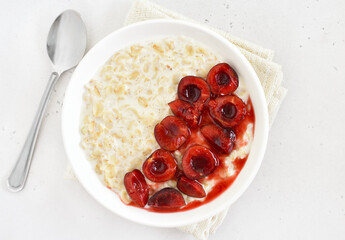 Oatmeal porridge with cherry slices