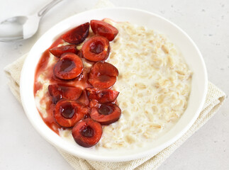 Oatmeal porridge with cherry slices