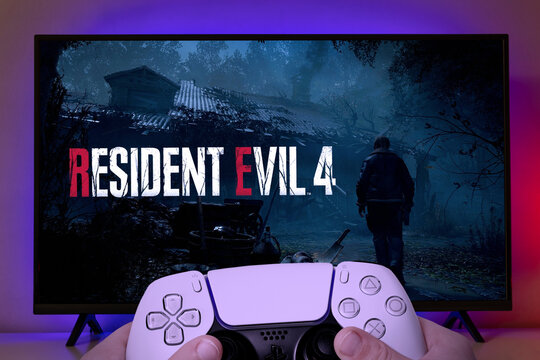 Man playing Resident Evil 4 Remake with Playstation controller on TV, 20 Mar, 2023, Sao Paulo, Brazil