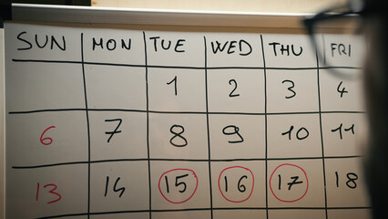 Looking important dates on the numbered calendar © Polonio Video