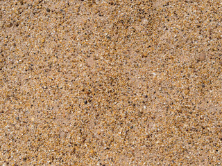 Background of pebbles. Wet stones. Multicolored pebbles