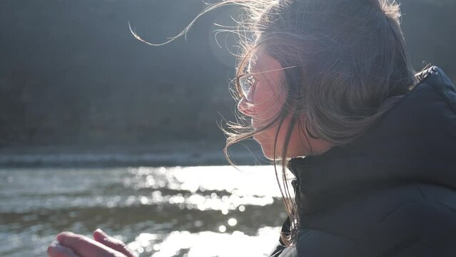 Close-up of woman playing rackets at the beach on a sunny day