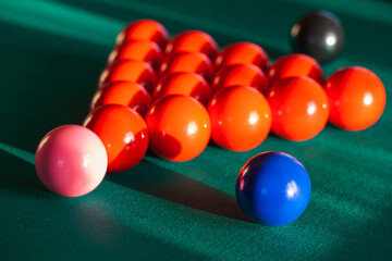 Colorful Snooker balls are on a pool table, close up photo