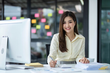 Business woman using calculator for do math finance on wooden desk in office and business working background, tax, accounting, statistics and analytic research concept..