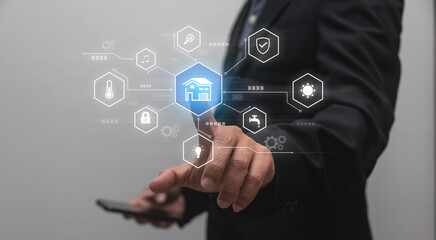 Obraz premium Businessman using smartphone with smart home instructions, 3D rendering