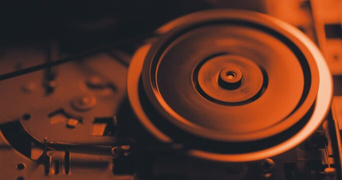 Close up of spinning mechanism inside cassette tape recorder