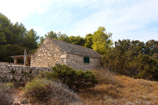 Traditional stone house and wild beach on Proizd, small island near Vela Luka, Croatia.