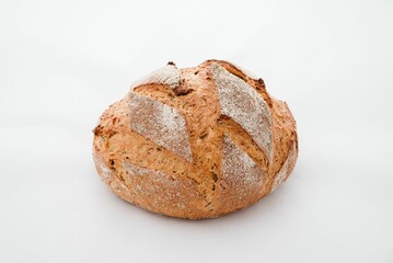 Closeup of rustic bread on a white surface