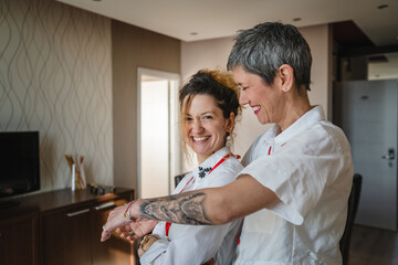 Fototapeta premium Two women happy caucasian female manager entrepreneur stand work