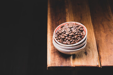 Premium Colombian Coffee Beans on Wooden Plank