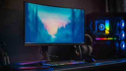 Modern Gaming PC desktop gaming setup, RGB lights, widescreen monitor and  water cooling. Blue and purple background