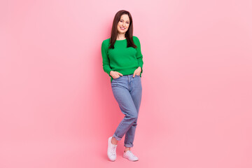 Full size photo of satisfied glad girl put hands pockets posing good mood isolated on pink color background