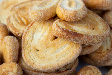 Puff sugar cookies in the form of hearts. Homemade baking. The concept of confectionery. Cooking.